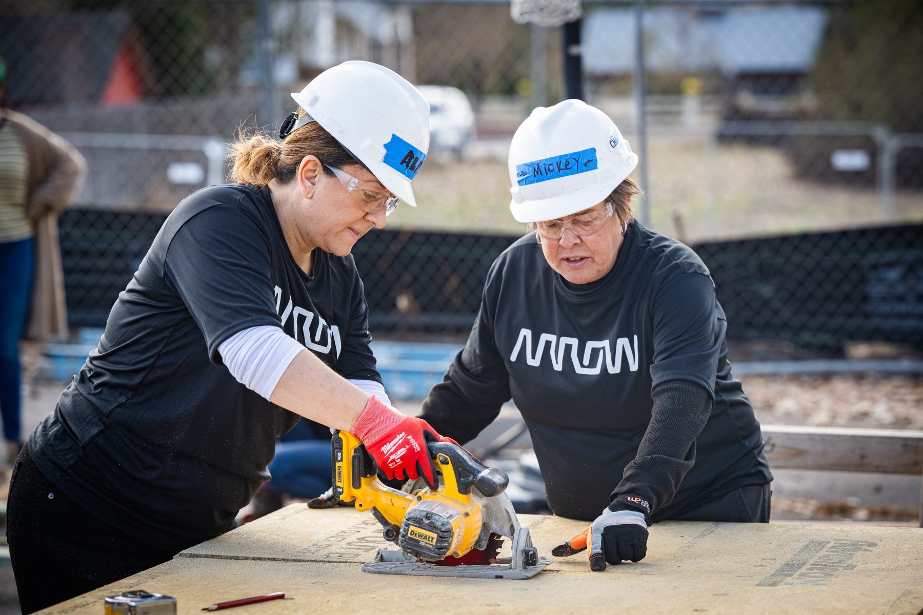 Arrow volunteers work on Habitat for Humanity’s Mountain View Community Homes